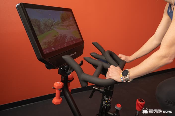 Peloton Bike+ vs Bowflex Velocore Rider Hands on Handlebars 